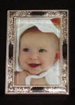 Click for full size image

All of our Sterling Silver frames have a tarnish resistant finish.